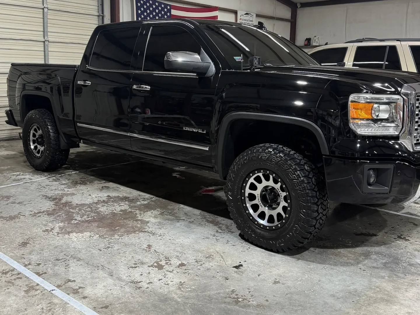 Black GMC Sierra Denali gleaming after a ceramic coating in Granbury