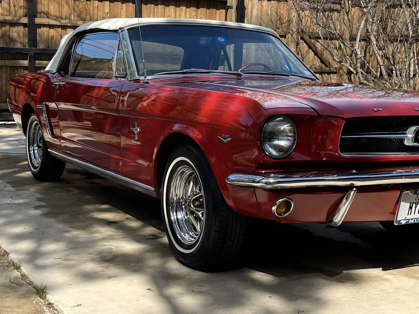 Red classic Ford Mustang convertible after detailing