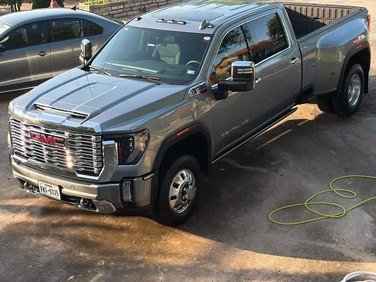 GMC dually pickup during a driveway wash and rinse