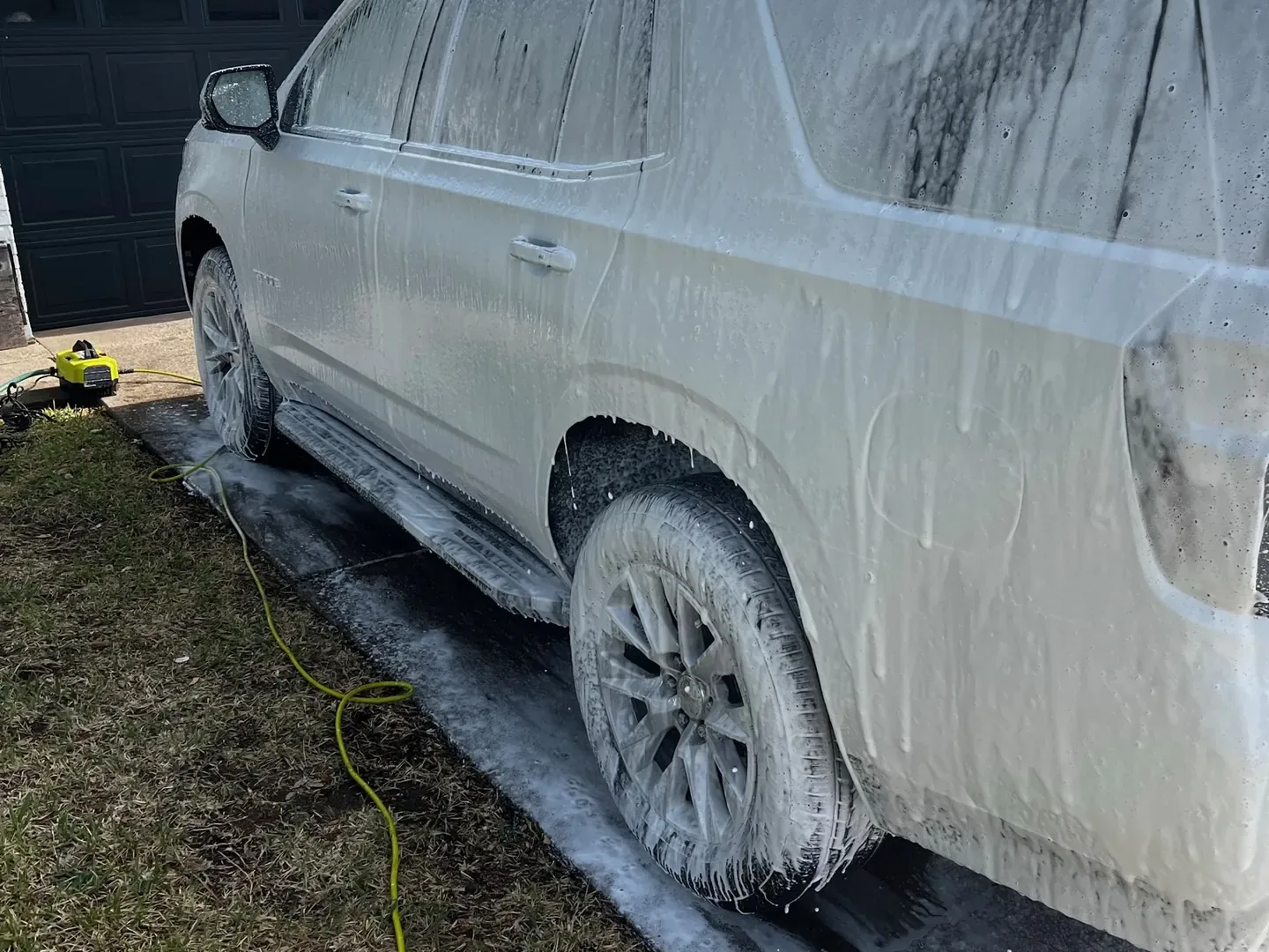 Chevrolet Tahoe covered in foam during a mobile hand wash